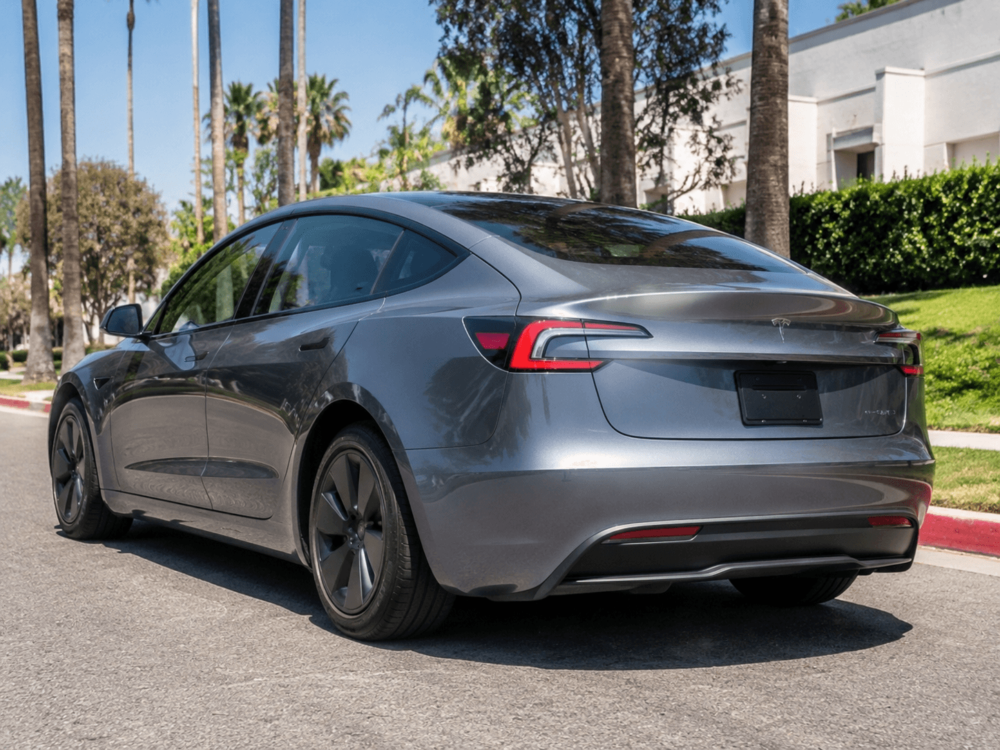 2023 Tesla Model 3 — efficient city EV rear_3q