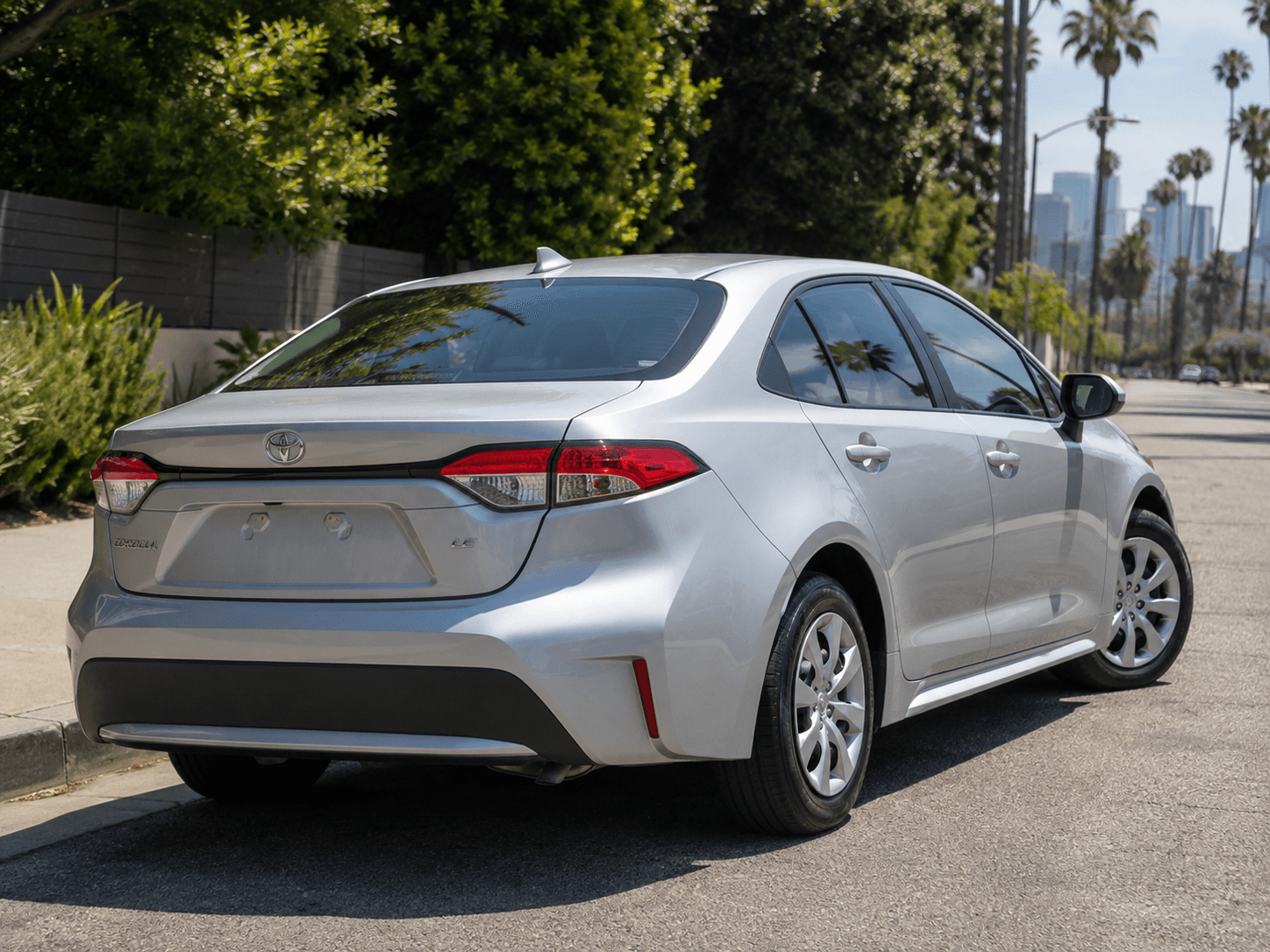 2022 Toyota Corolla LE — LAX pickup/drop-off rear_3q