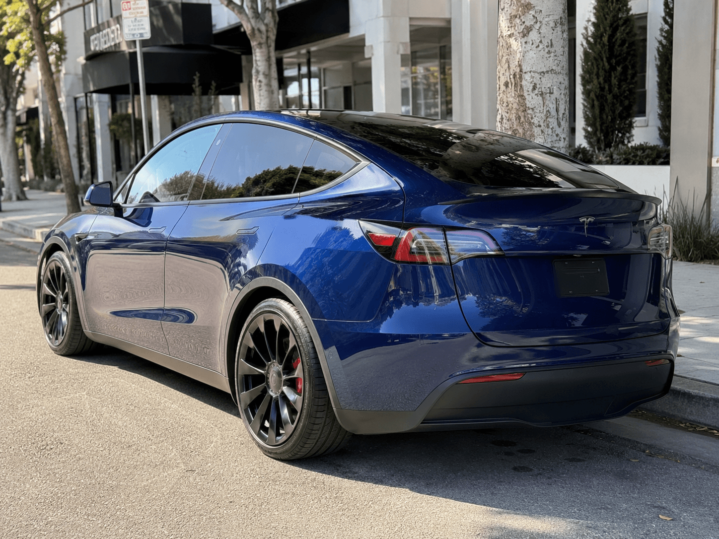 2023 Tesla Model Y Performance — quickest SUV around rear_3q