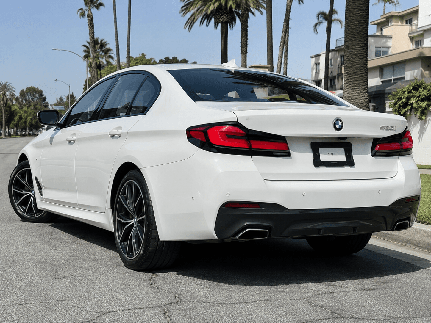 2023 BMW 530i — executive sedan rear_3q